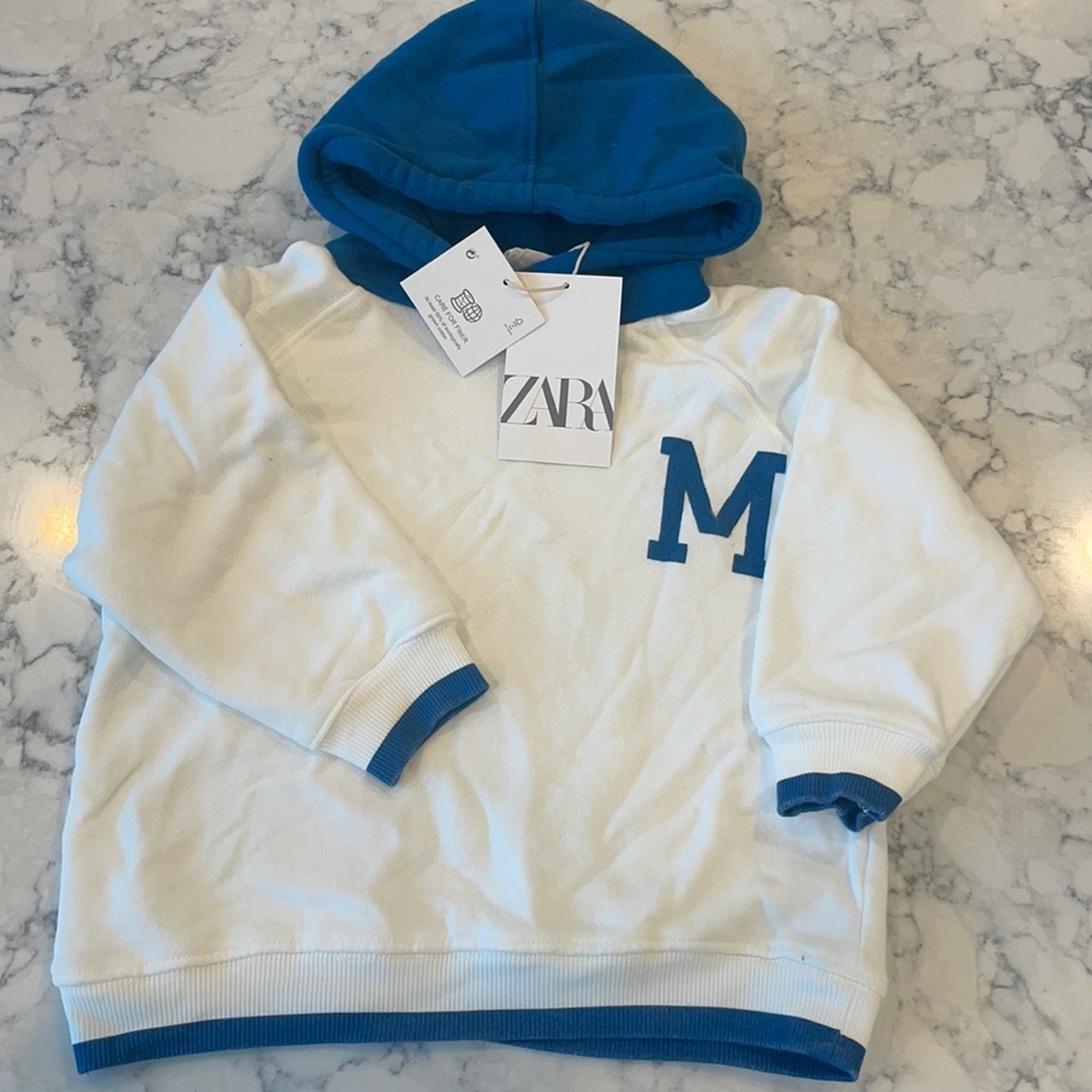Pullover sweater from Zara with an “M” logo